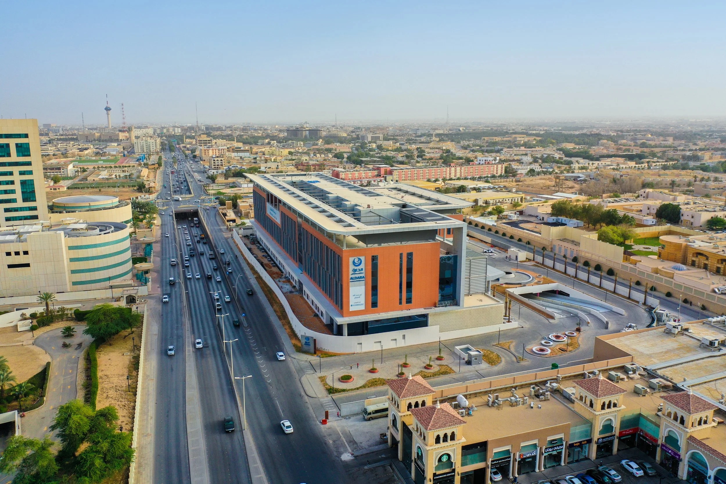 Aerial view of Aldara Hospital beside a main road in Riyadh