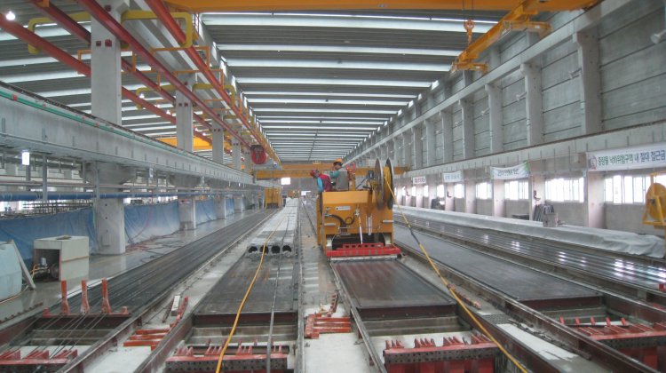 Long casting beds inside an automated precast production factory